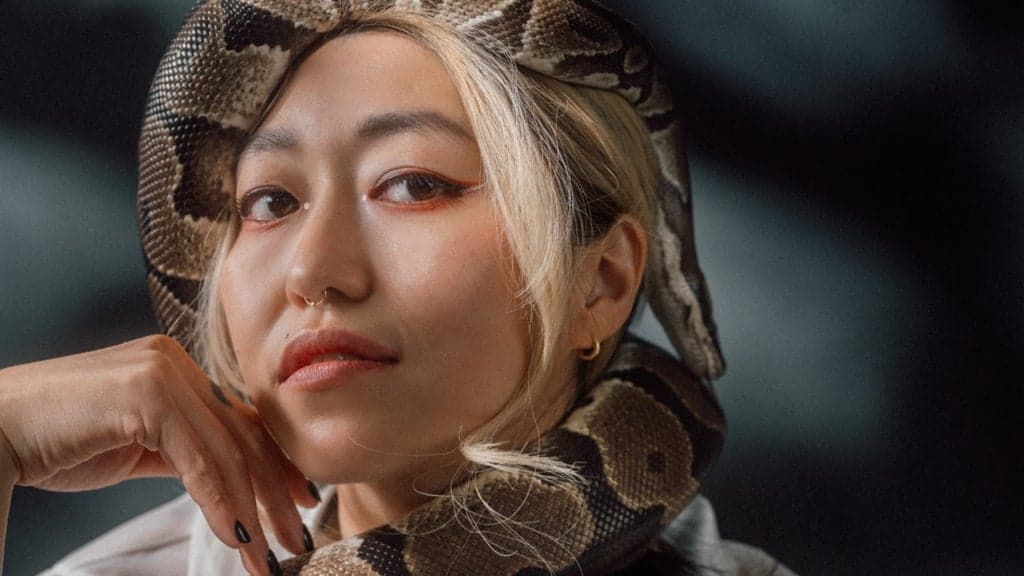 Promotional image for Lee Emi (Emilee Petersmark of The Crane Wives) - with Cal in Red