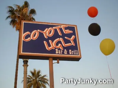 Venue sign and event banner at Coyote Ugly Bar & Grill, May 29, 2004