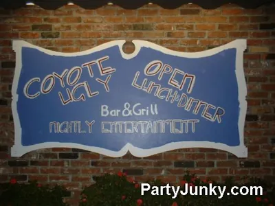 Venue sign and event banner at Coyote Ugly Bar & Grill, May 29, 2004