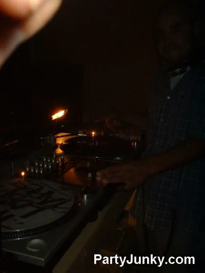 DJ at the turntables at Coyote Ugly Bar & Grill, May 29, 2004