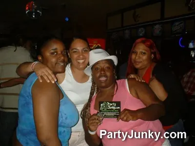 Guests posing for the camera at Coyote Ugly Bar & Grill, May 29, 2004