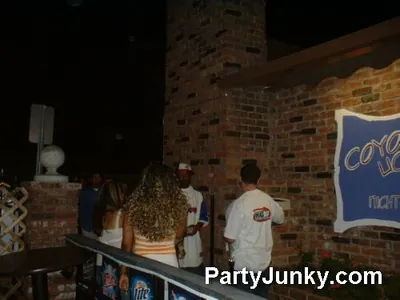 Guests outside Coyote Ugly Bar & Grill at night, May 29, 2004