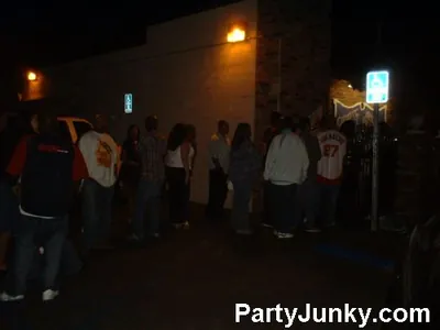 Guests outside Coyote Ugly Bar & Grill at night, Jun 5, 2004
