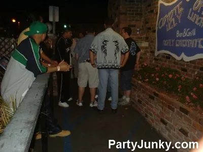 Guests outside Coyote Ugly Bar & Grill at night, Jun 5, 2004