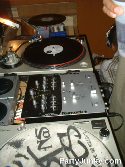 DJ at the turntables at Coyote Ugly Bar & Grill, Jun 12, 2004