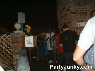 Guests outside Coyote Ugly Bar & Grill at night, Jun 19, 2004