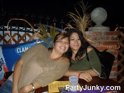 Guests posing for the camera at Coyote Ugly Bar & Grill, Jun 19, 2004