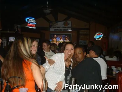 Guests posing for the camera at Coyote Ugly Bar & Grill, Jun 19, 2004