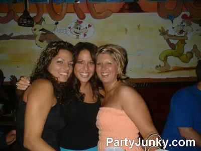 Guests posing for the camera at Coyote Ugly Bar & Grill, Jun 19, 2004