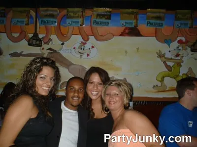Guests posing for the camera at Coyote Ugly Bar & Grill, Jun 19, 2004