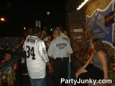Guests outside Coyote Ugly Bar & Grill at night, Jun 19, 2004