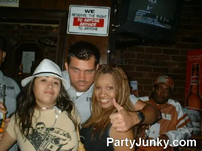 Guests posing for the camera at Coyote Ugly Bar & Grill, Jul 3, 2004