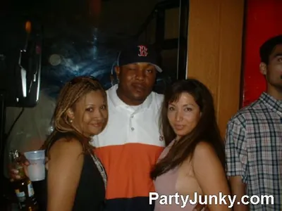 Guests posing for the camera at Coyote Ugly Bar & Grill, Jul 3, 2004