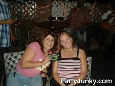 Guests posing for the camera at Coyote Ugly Bar & Grill, Jul 3, 2004