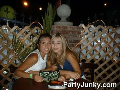 Guests posing for the camera at Coyote Ugly Bar & Grill, Jul 3, 2004