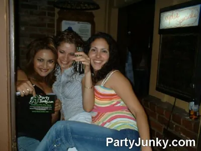 Guests posing for the camera at Coyote Ugly Bar & Grill, Jul 3, 2004