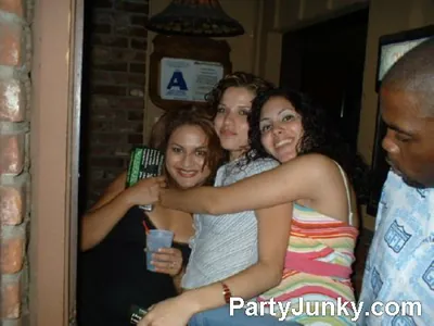 Guests posing for the camera at Coyote Ugly Bar & Grill, Jul 3, 2004