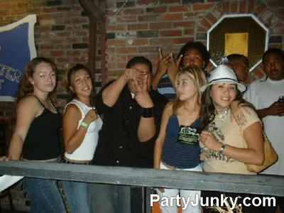 Guests posing for the camera at Coyote Ugly Bar & Grill, Jul 3, 2004