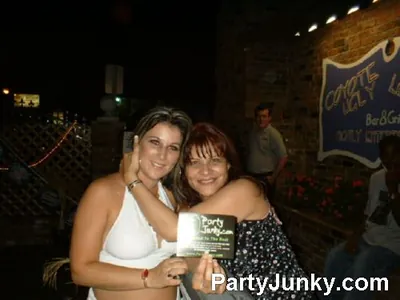 Guests posing for the camera at Coyote Ugly Bar & Grill, Jul 3, 2004