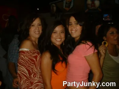 Guests posing for the camera at Coyote Ugly Bar & Grill, Jul 10, 2004