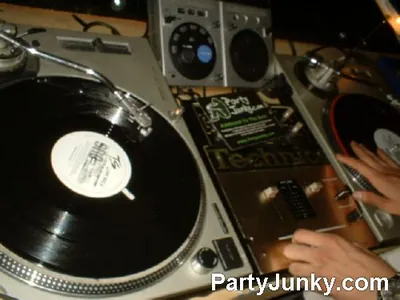 DJ at the turntables at Coyote Ugly Bar & Grill, Jul 10, 2004