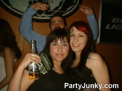 Guests posing for the camera at Coyote Ugly Bar & Grill, Jul 10, 2004