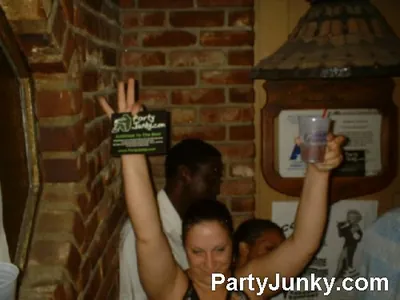 Guests posing for the camera at Coyote Ugly Bar & Grill, Jul 10, 2004