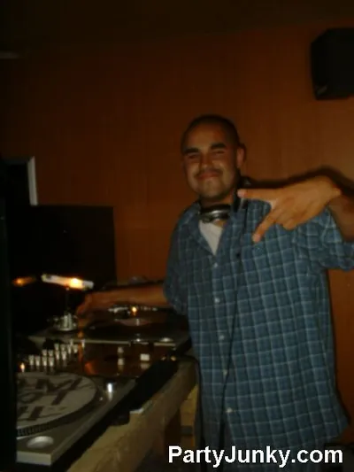 DJ at the turntables at Coyote Ugly Bar & Grill, Jul 10, 2004