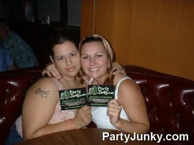 Guests posing for the camera at Coyote Ugly Bar & Grill, Jul 31, 2004