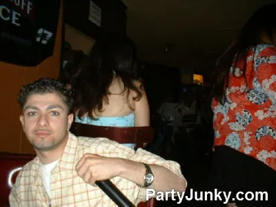 Guests posing for the camera at Coyote Ugly Bar & Grill, Jul 31, 2004