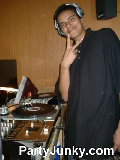 DJ at the turntables at Coyote Ugly Bar & Grill, Jul 31, 2004