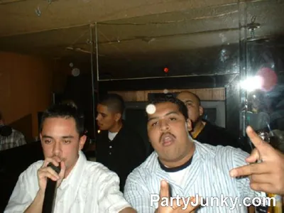 Hosts on the microphone at Coyote Ugly Bar & Grill, Jul 31, 2004