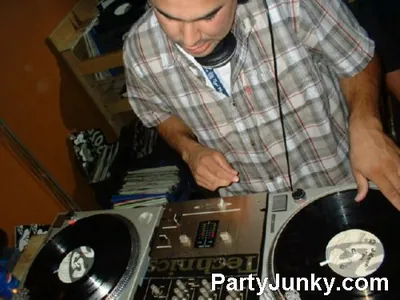 DJ at the turntables at Coyote Ugly Bar & Grill, Jul 31, 2004