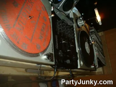 DJ at the turntables at Coyote Ugly Bar & Grill