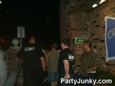 Guests outside Coyote Ugly Bar & Grill at night