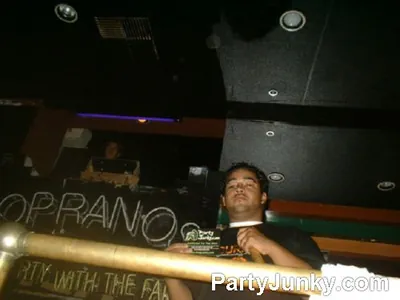 DJ at the turntables at Sopranos Night Club, Aug 13, 2004