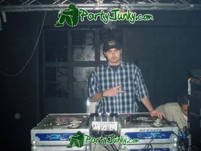 DJ at the turntables at the Suga Free concert, Dec 14, 2003